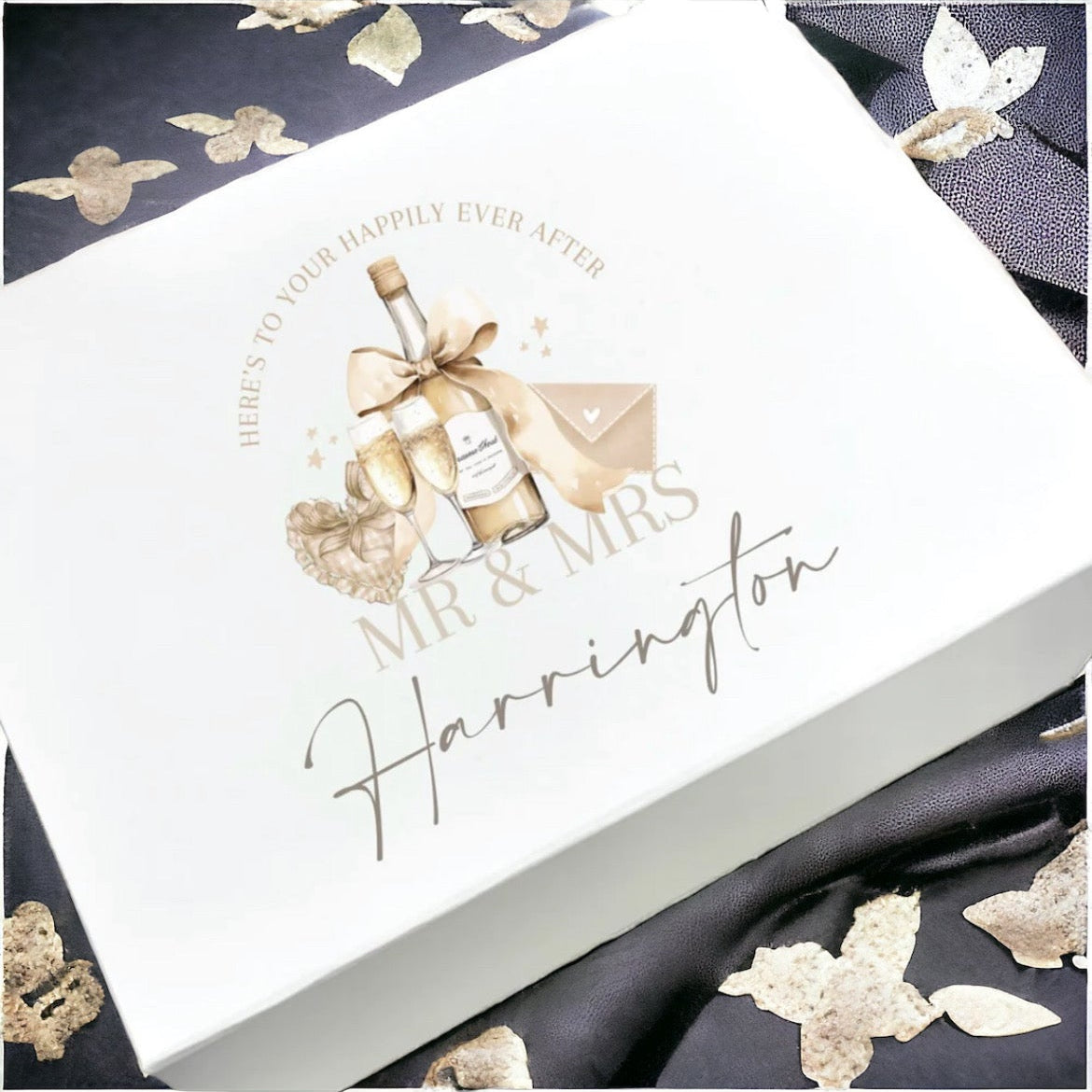Wedding invitation card with gold ribbons and butterflies on a white background