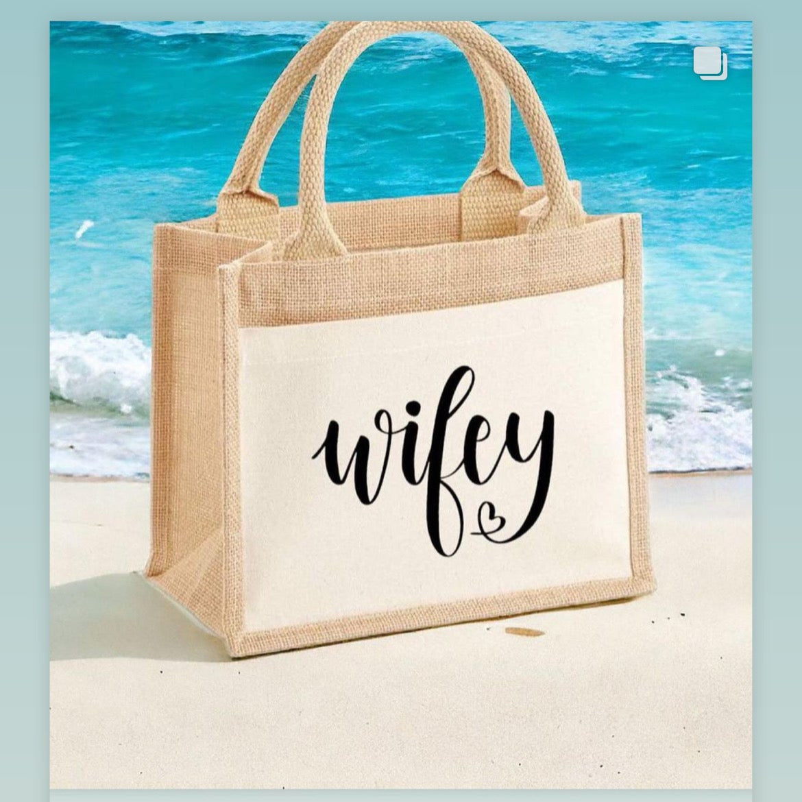 Beige tote bag with 'wifey' text on a beach background